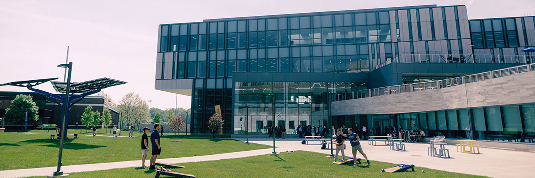 An aerial view of Kettering's bell tower in the foreground and the Learning Commons in the background